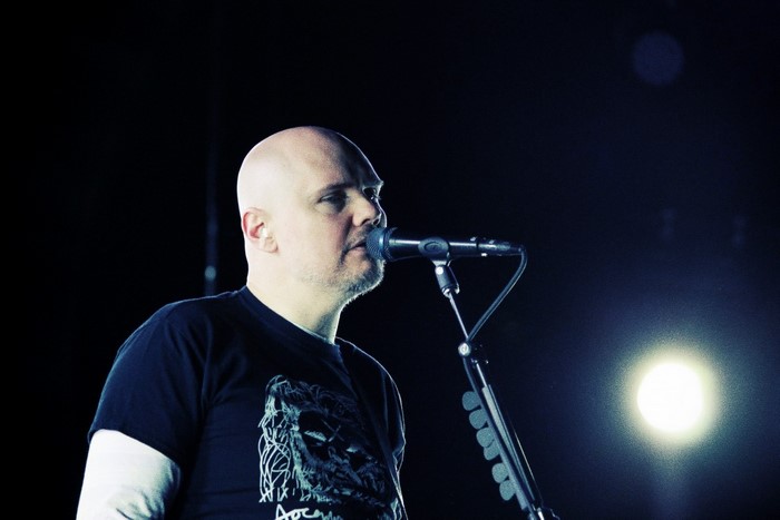 Billy Corgan performing on stage