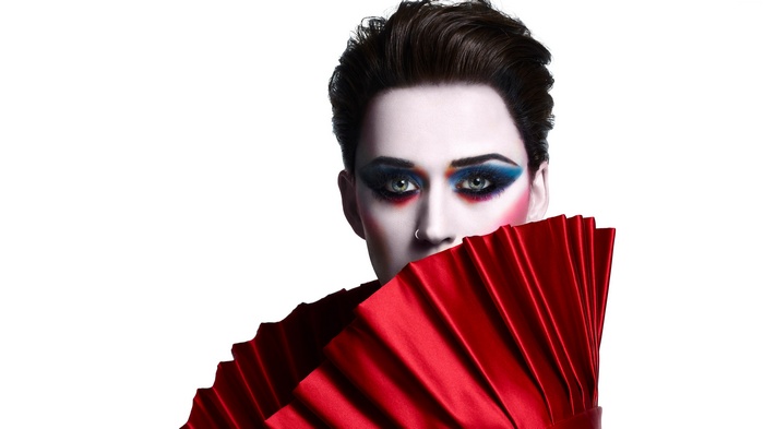 Katy Perry with red fan and dramatic makeup