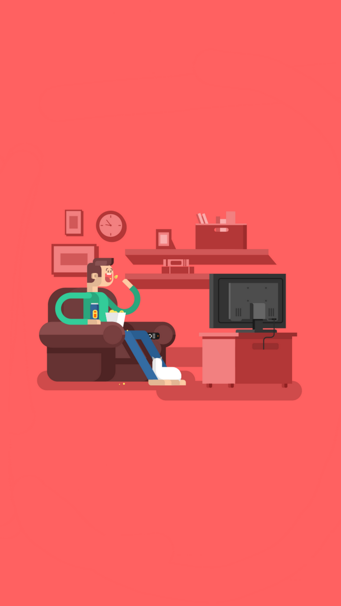 Man eating popcorn while watching TV