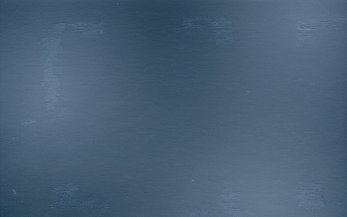 Blue textured surface with faint marks