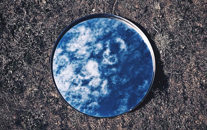 Mirror reflecting the sky on the ground