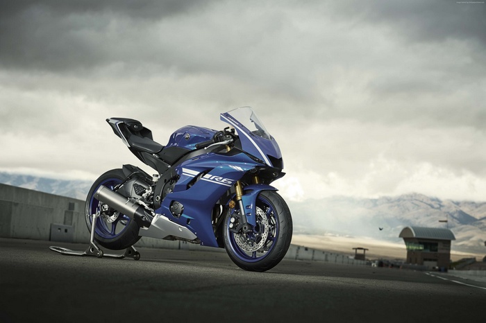 Blue Yamaha YZF-R6 motorcycle on a race track