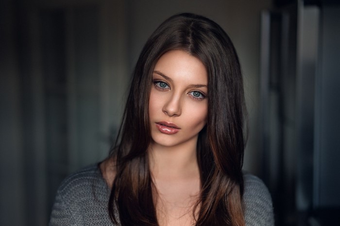 Portrait of a young woman with long brown hair