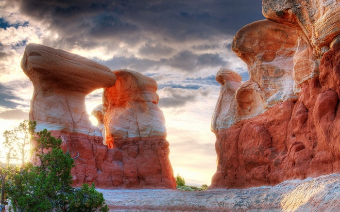 Rock formations in a desert landscape at sunset