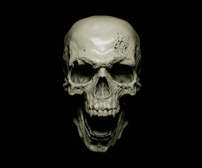 Sculpted skull with holes and open jaw