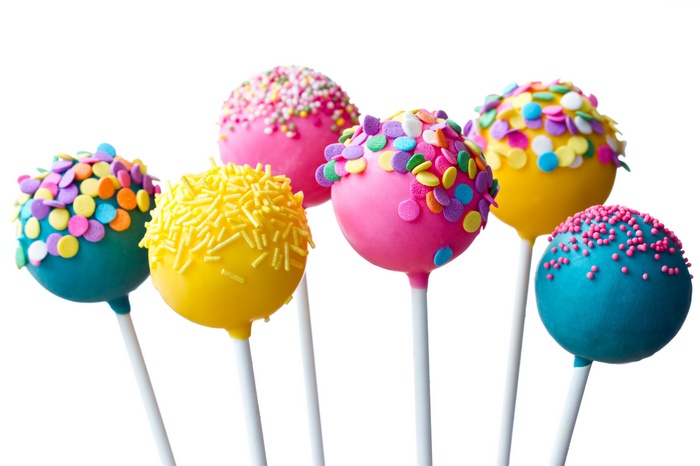 Colorful cake pops with sprinkles and frosting