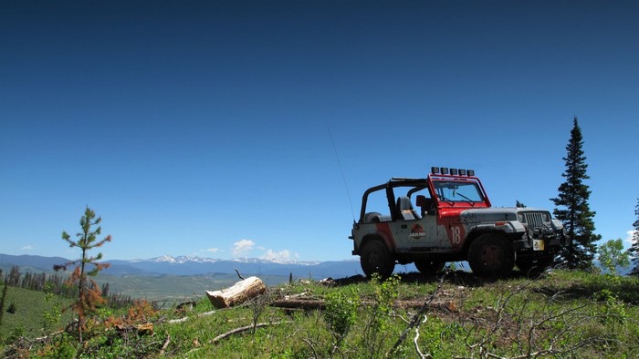 Jurassic Park Jeep on a mountain ridge