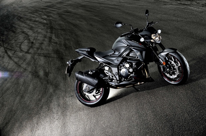 Suzuki GSX-S750 motorcycle on asphalt with tire marks
