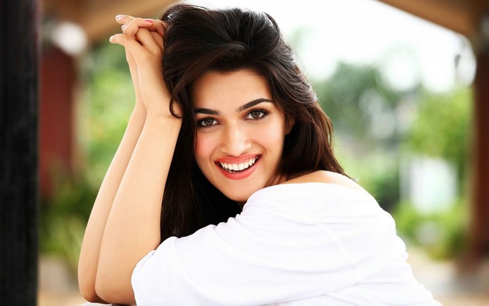 Kriti Sanon smiling with hands in hair