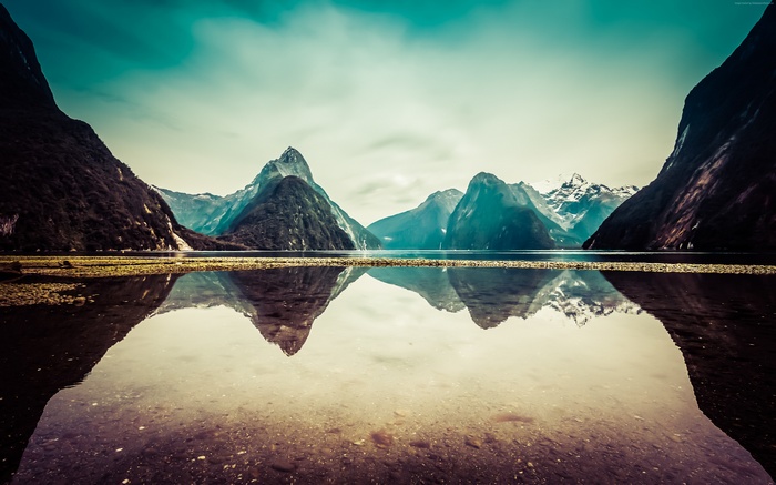 Milford Sound mountains reflected in water, New Zealand