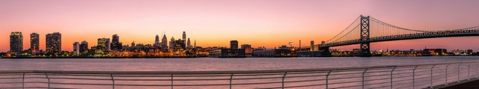 Philadelphia cityscape and Benjamin Franklin Bridge at sunset