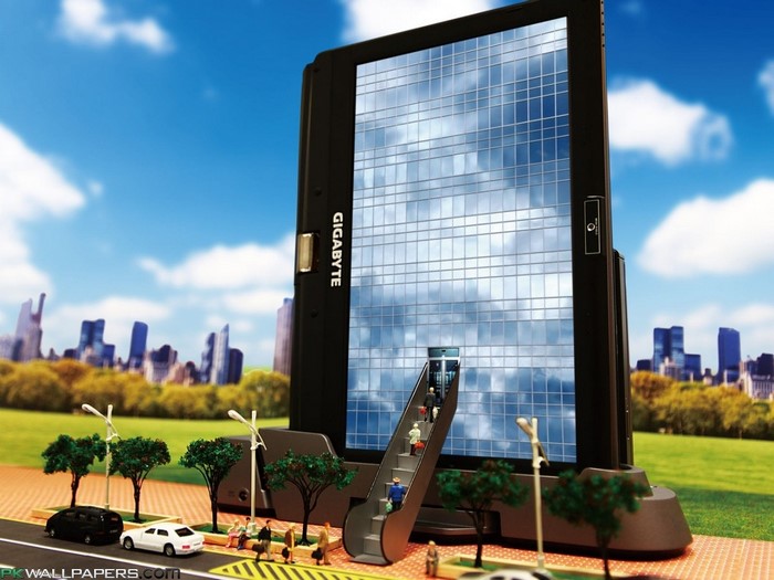 Gigabyte computer screen building with miniature city and people