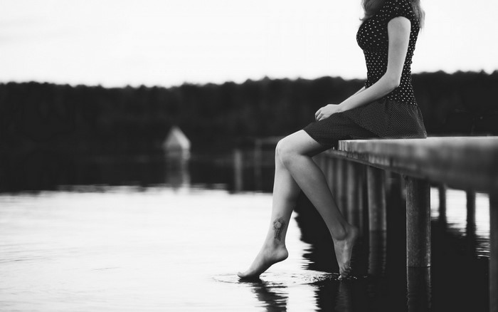 Monochrome Portrait of Woman Sitting by the River
