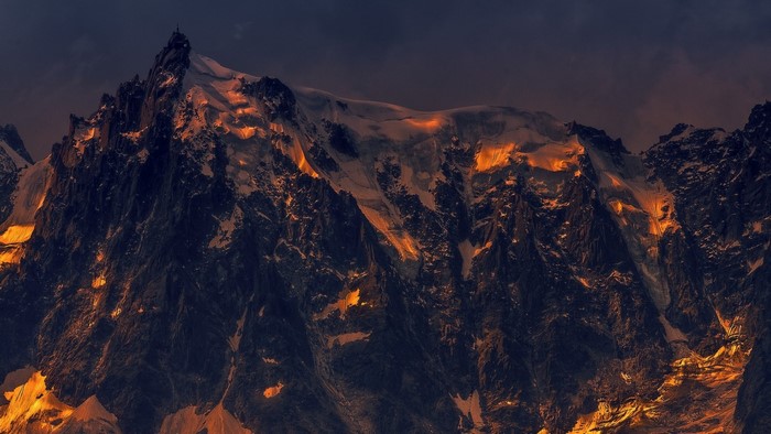 Mountain range illuminated by sunset light