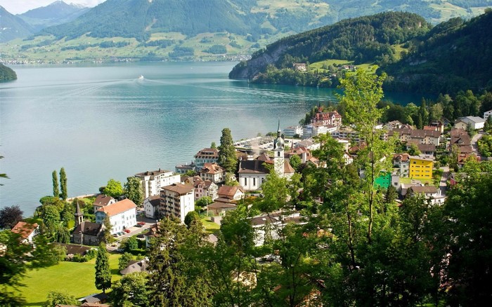 Town on a lake with mountains in the background