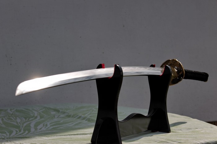 Katana sword on a black stand