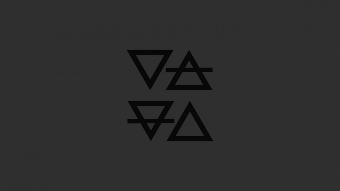 Four elemental symbols on dark background