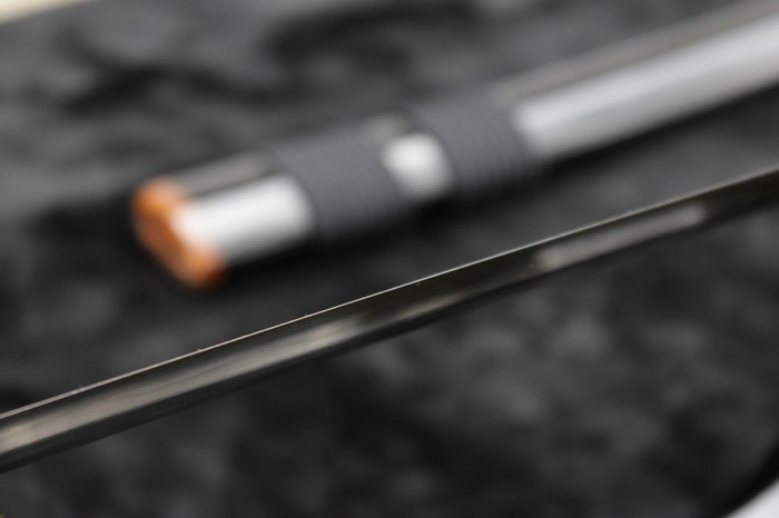 Close-up of a katana sword blade and handle