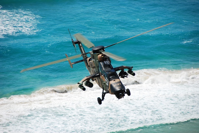 Australian Army Eurocopter Tiger attack helicopter over ocean