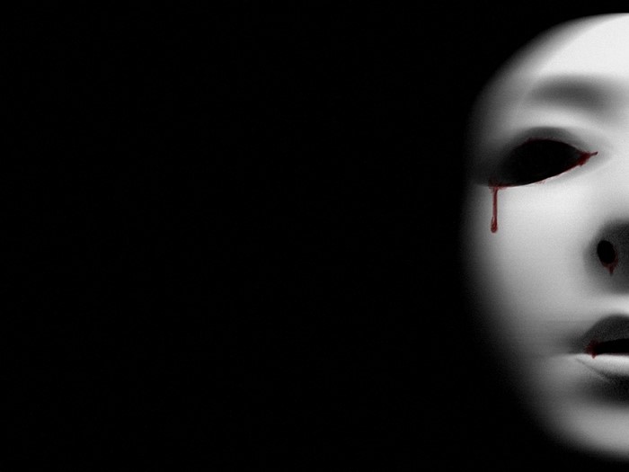White mask with blood dripping from eyes and lips