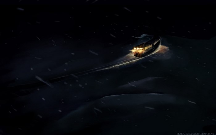 Train in the snow at night