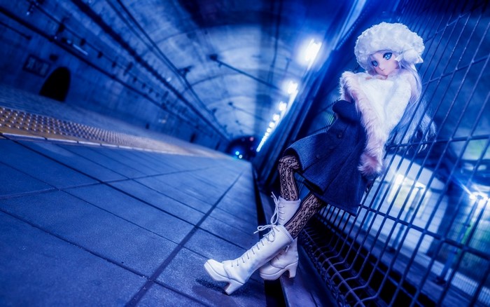 Anime girl in a blue subway tunnel