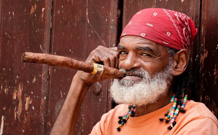 Man with beard smoking a cigar in Cuba