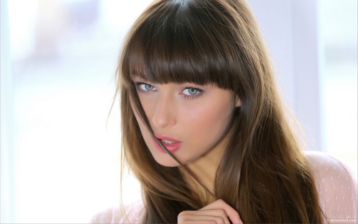 Yarina A portrait with brown hair and bangs