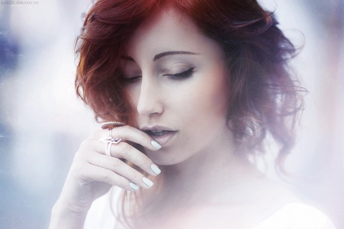 Woman with red hair and rings