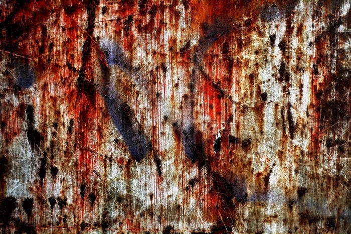 Rusted metal texture with graffiti