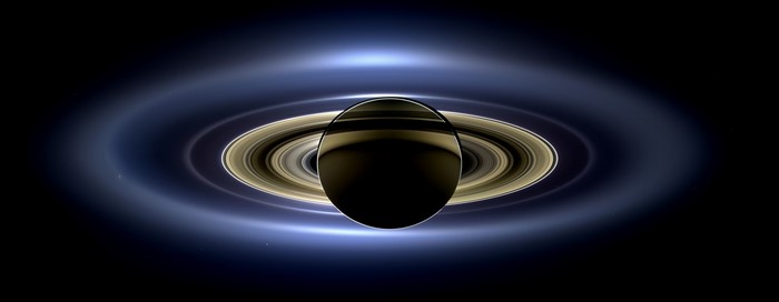 Saturn and its rings with a blue glow