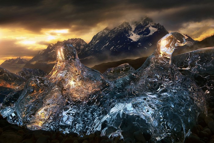 Ice formations in front of mountains at sunset