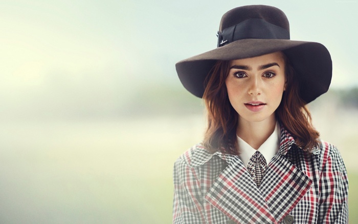 Lily Collins wearing a hat and trench coat
