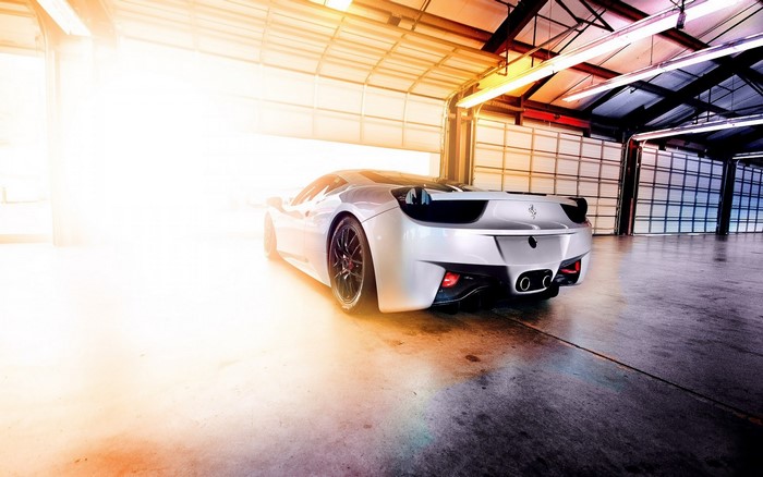White Ferrari sports car in a garage