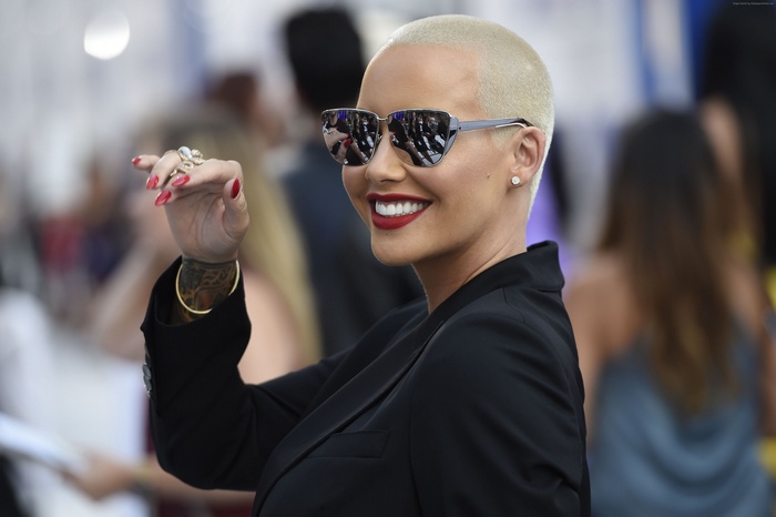 Amber Rose wearing sunglasses and a black blazer