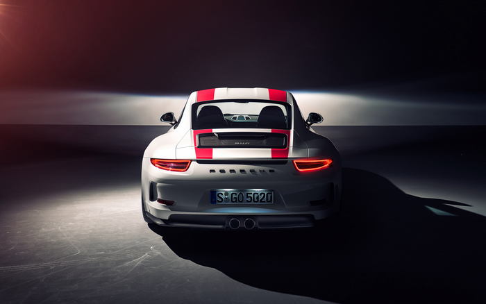Rear view of a white Porsche 911 GT3 with red stripes