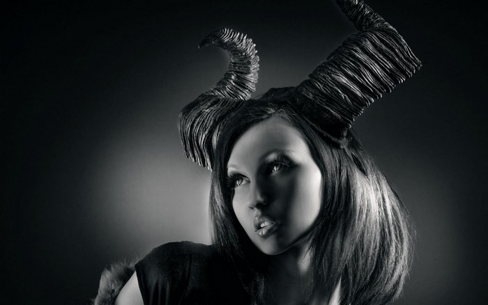 Woman with large horns in black and white
