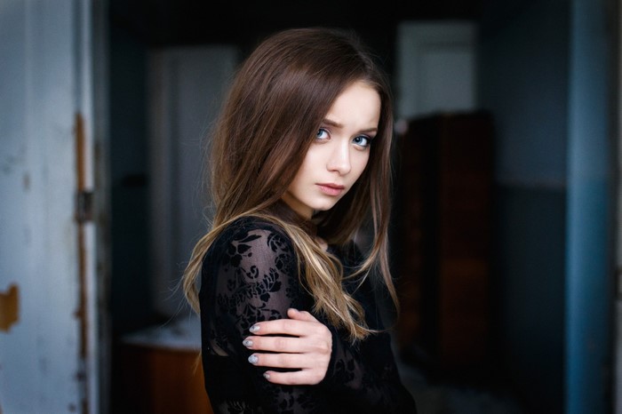 Portrait of a young woman with long brown hair