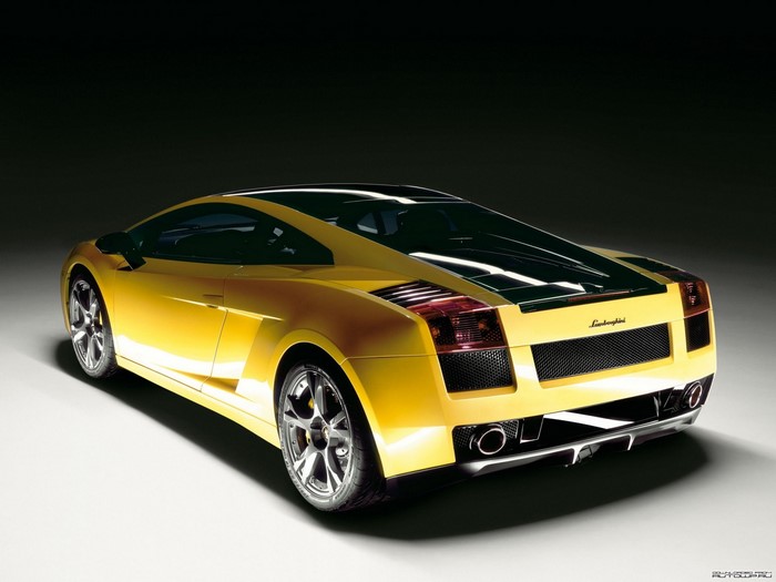 Yellow Lamborghini Gallardo parked on a white surface
