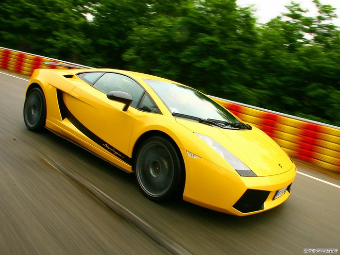 Yellow Lamborghini Gallardo Super Trofeo Stradale on a race track