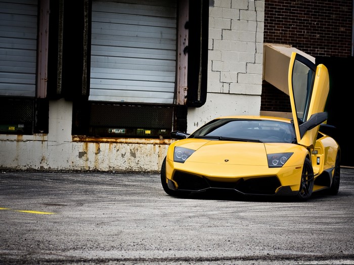Yellow Lamborghini with Scissor Doors in Industrial Area