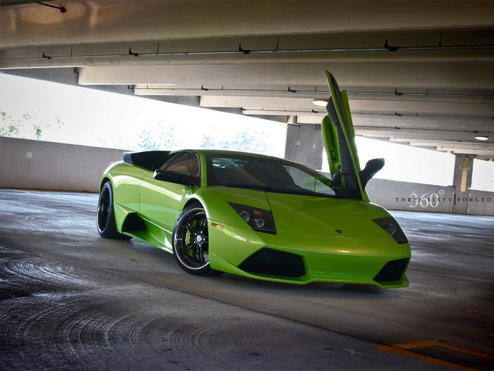 Lime green Lamborghini with scissor doors open