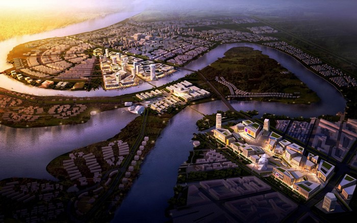 Aerial view of a modern city development along a river