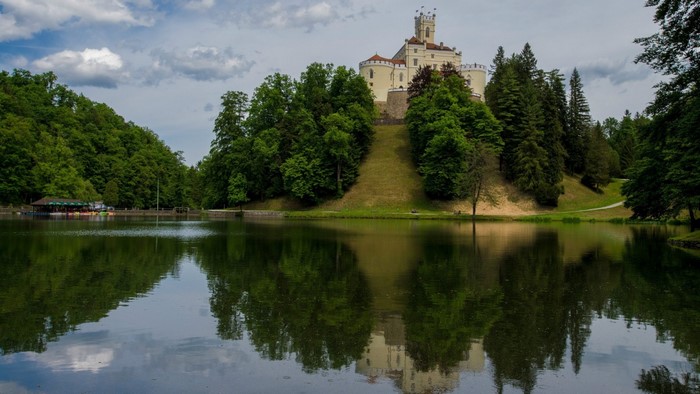 Trakoscan Castle on Hill by Reflective Lake