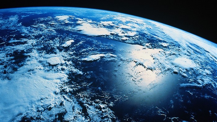Earth from space with clouds and oceans
