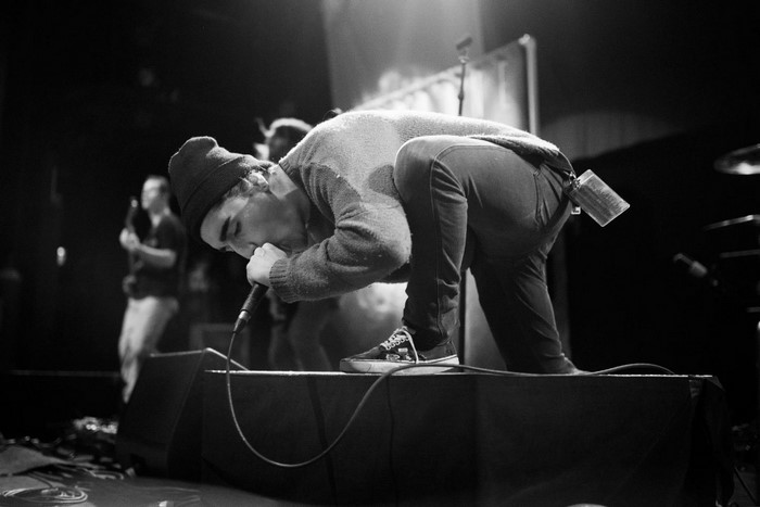 Man performing on stage at a concert