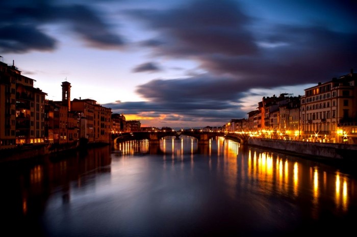 Florence cityscape at dusk with Arno River and Ponte Vecchio