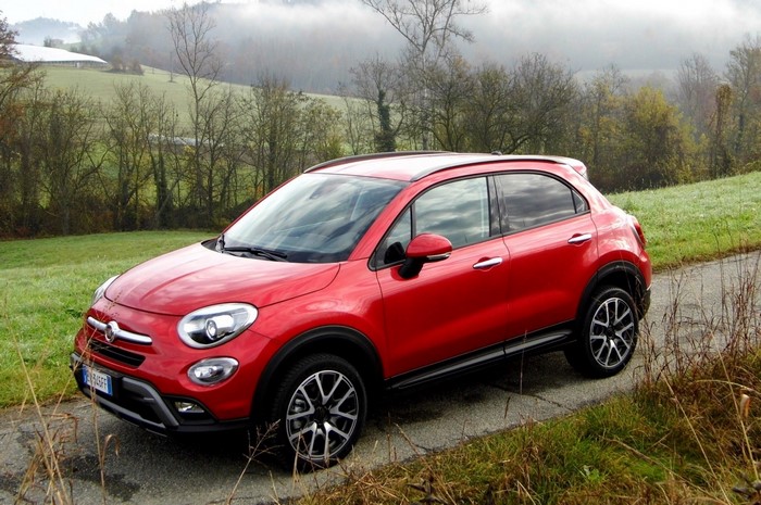 Red Fiat 500X parked on a rural road