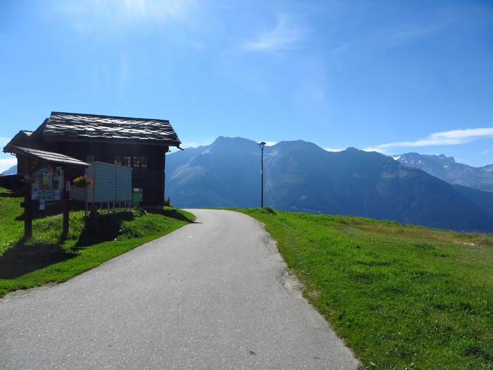 Road to Swiss Alps Mountains with Wooden House
