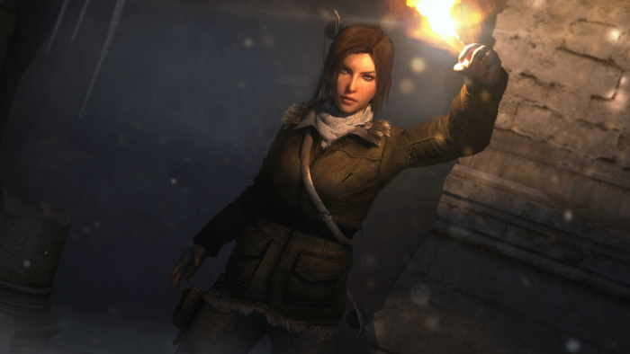 Lara Croft from Rise of the Tomb Raider holding a torch